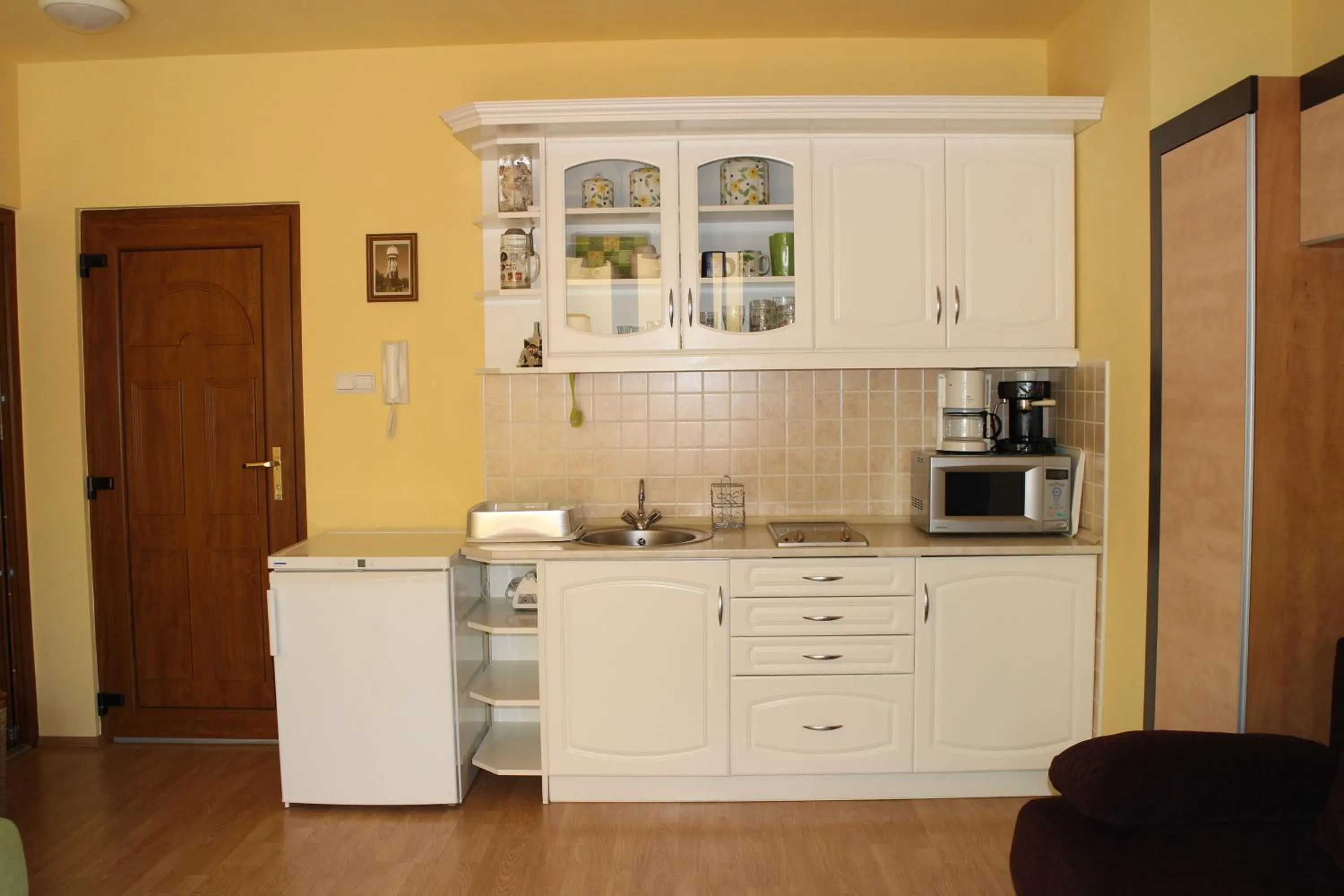 Kitchen or kitchenette in Mandarin Wellness Apartman