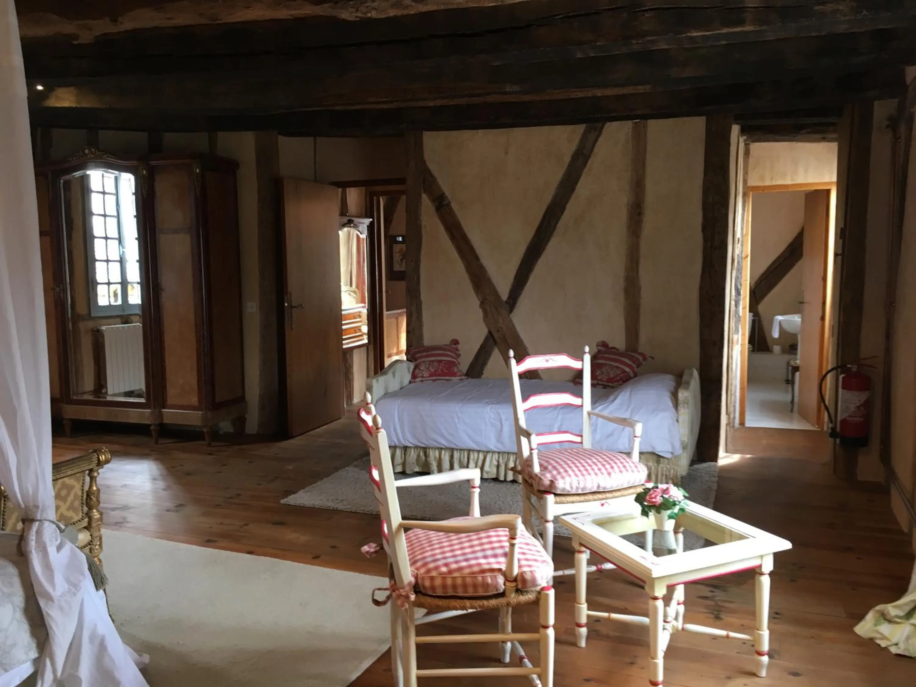 Bedroom in La Roseraie Hôtel Restaurant