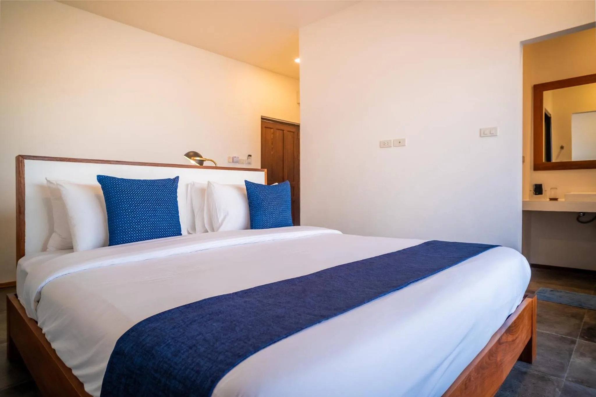 Bed in The Riviera Champasak