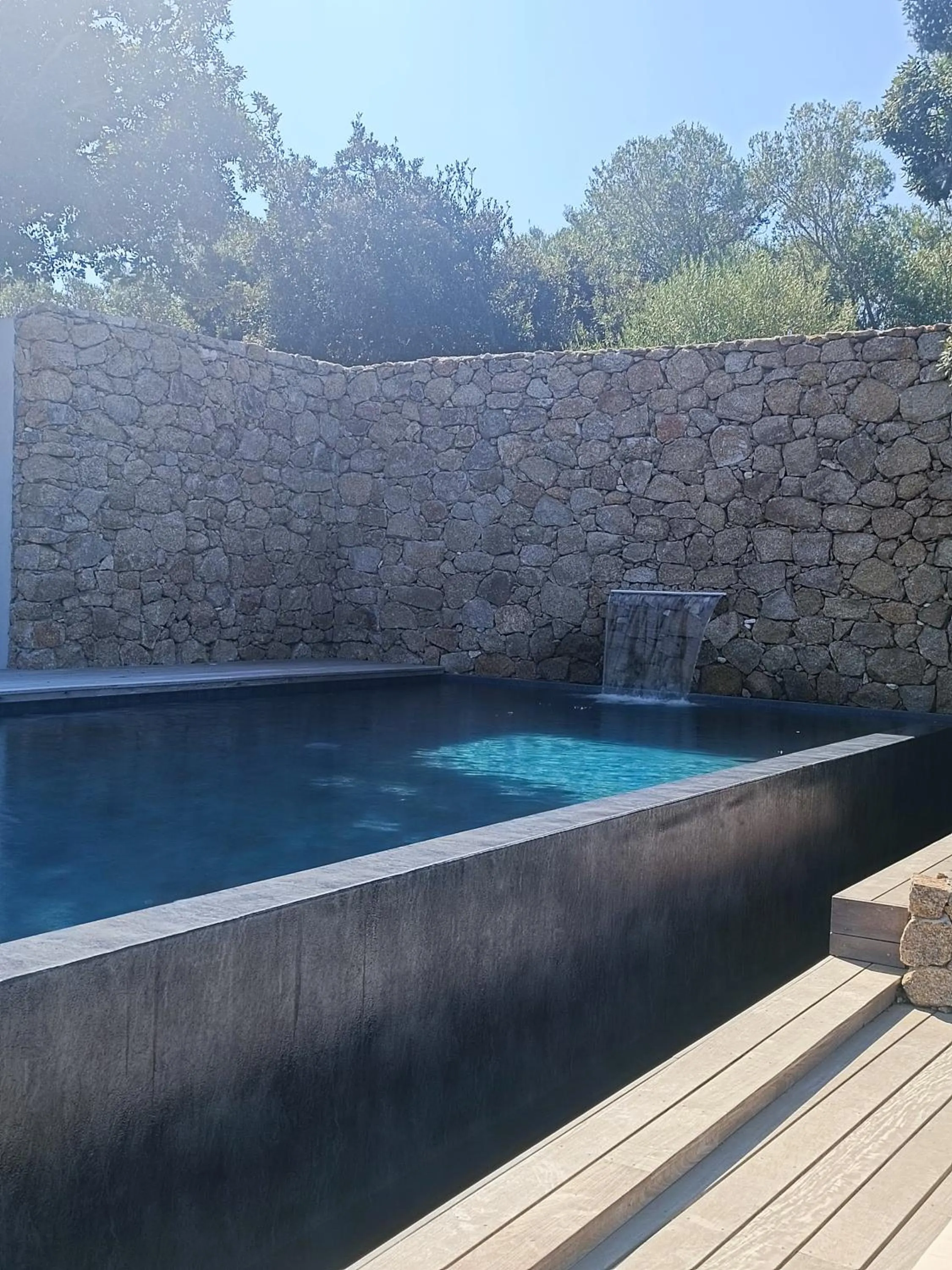 Swimming pool in Hôtel Les Suites Du Maquis