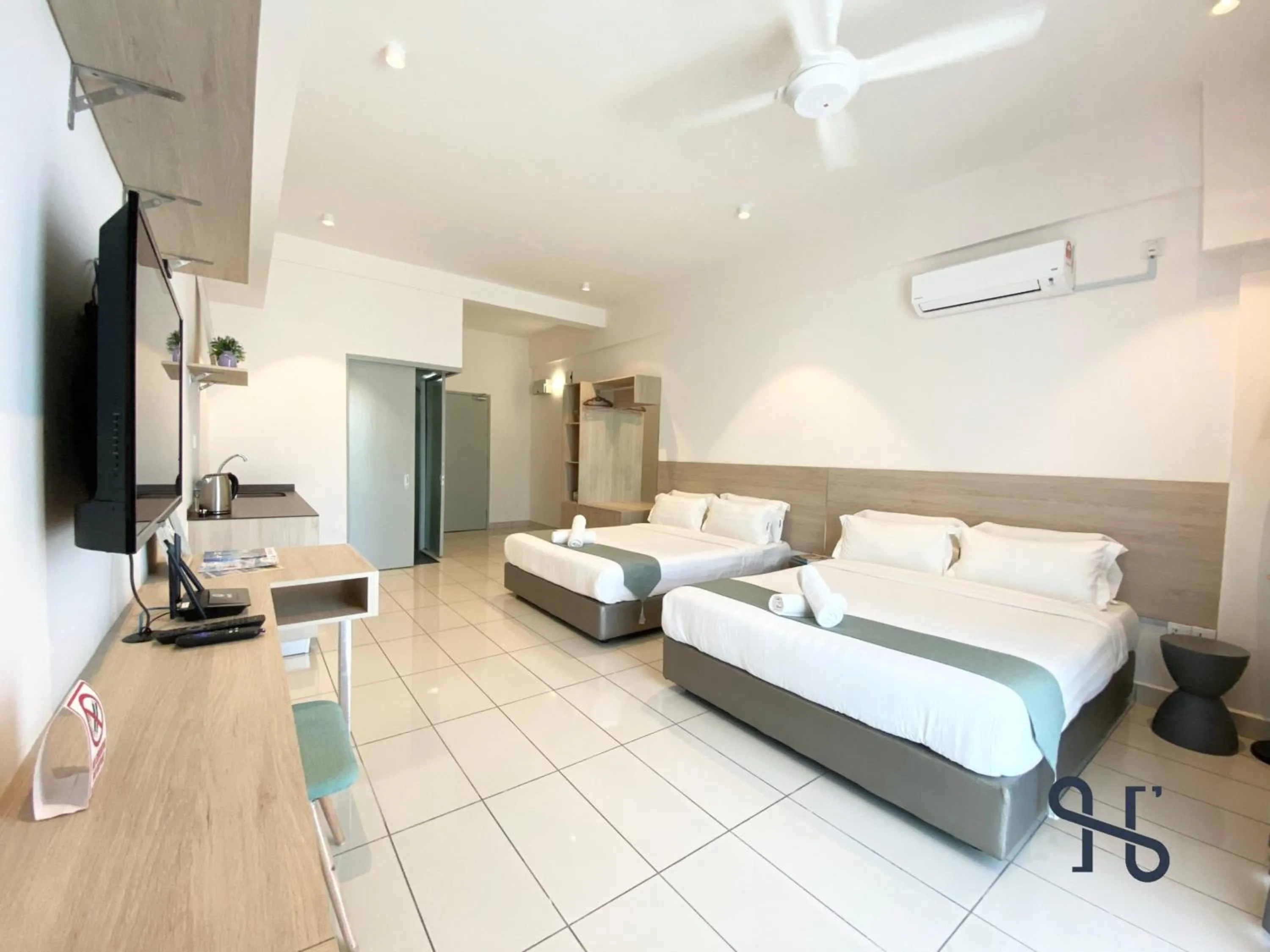 Bed in Homesuite' Home at Aeropod SOVO