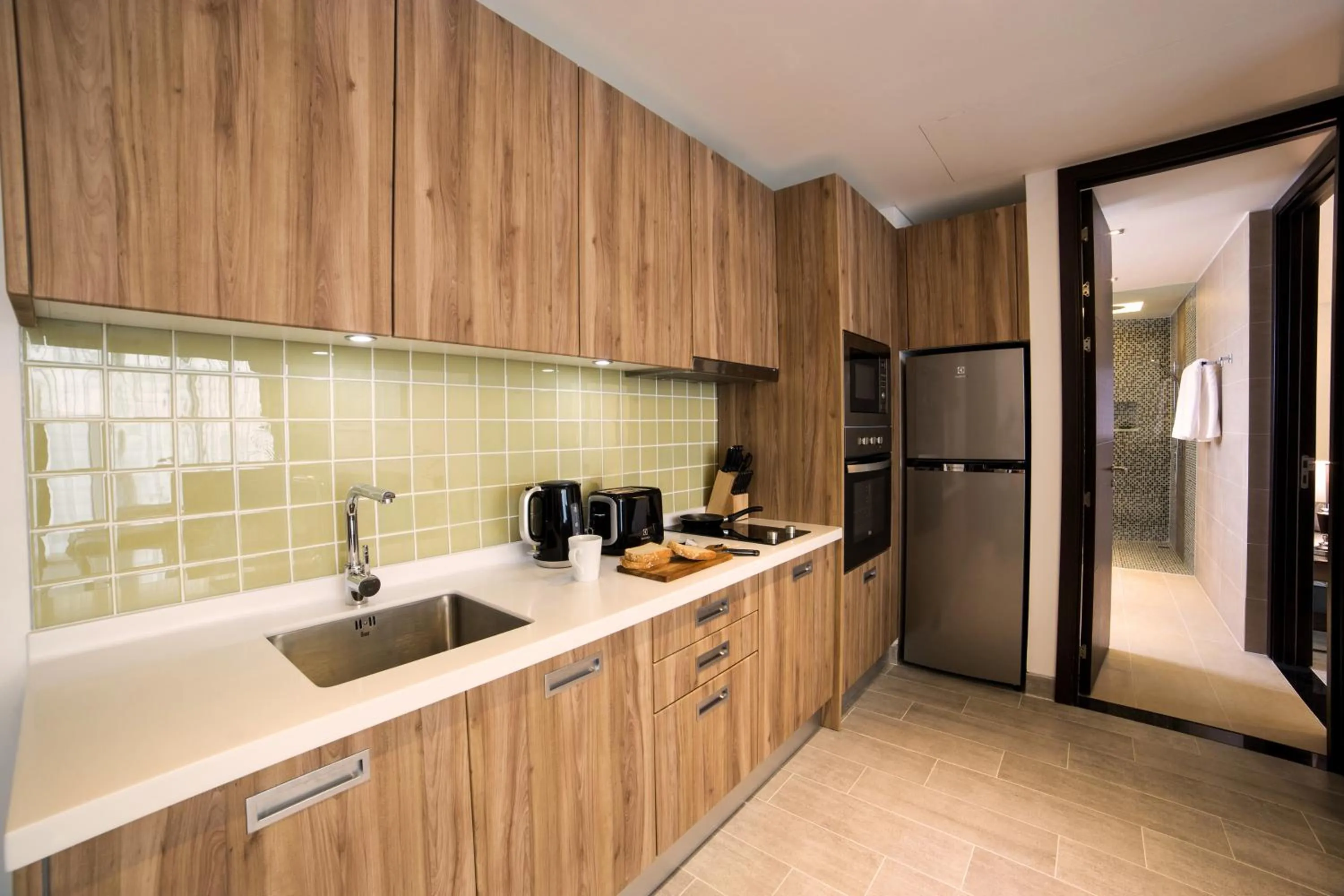 Kitchen or kitchenette in Lets Phuket Twin Sands Resort & Spa