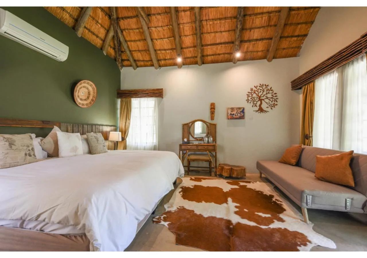 Bed in Mziki Safari Lodge