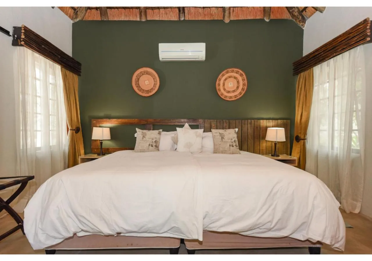 Bed in Mziki Safari Lodge