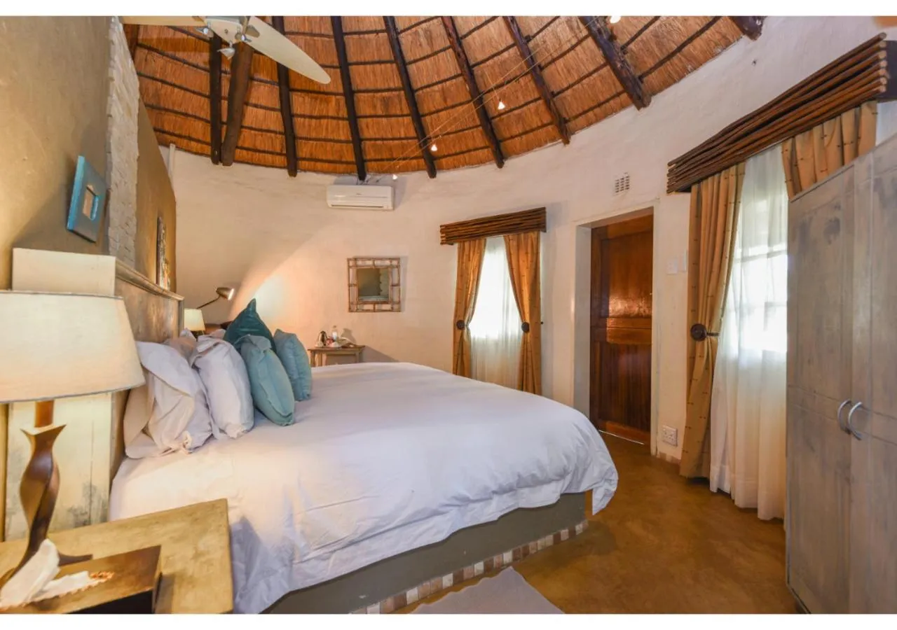 Bed in Mziki Safari Lodge