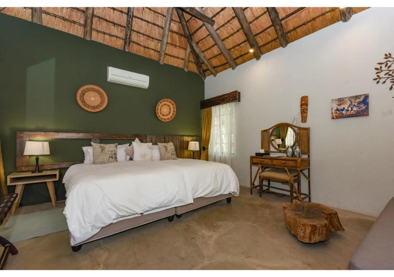 Bed in Mziki Safari Lodge