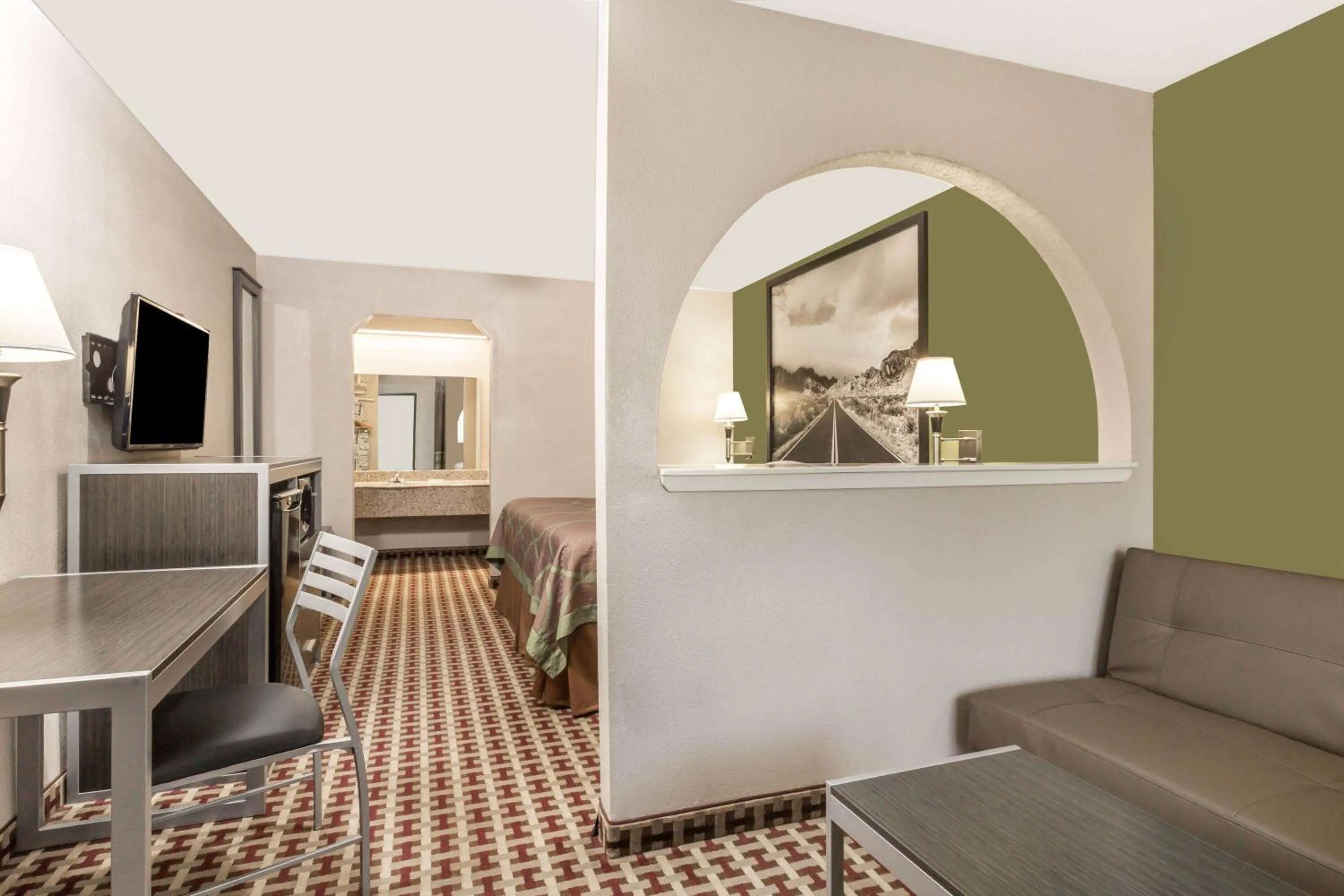 Bed in Super 8 by Wyndham Houston Webster NASA