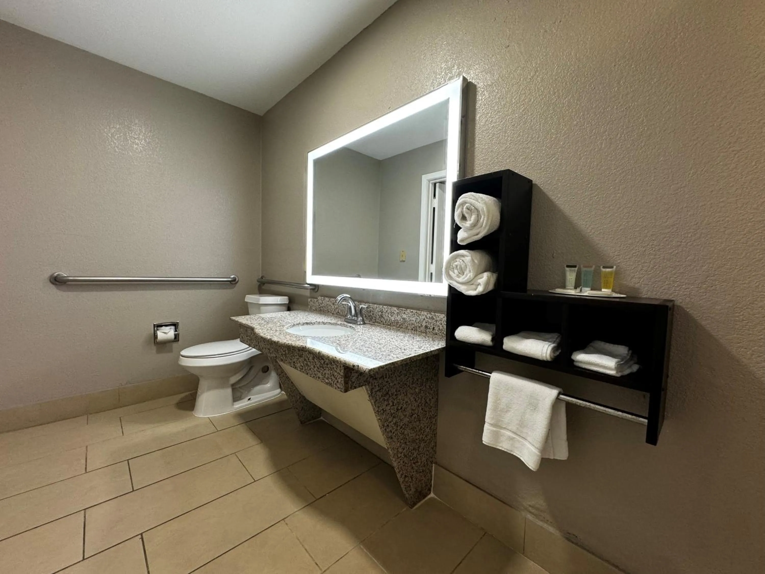 Bathroom in Super 8 by Wyndham Houston Webster NASA