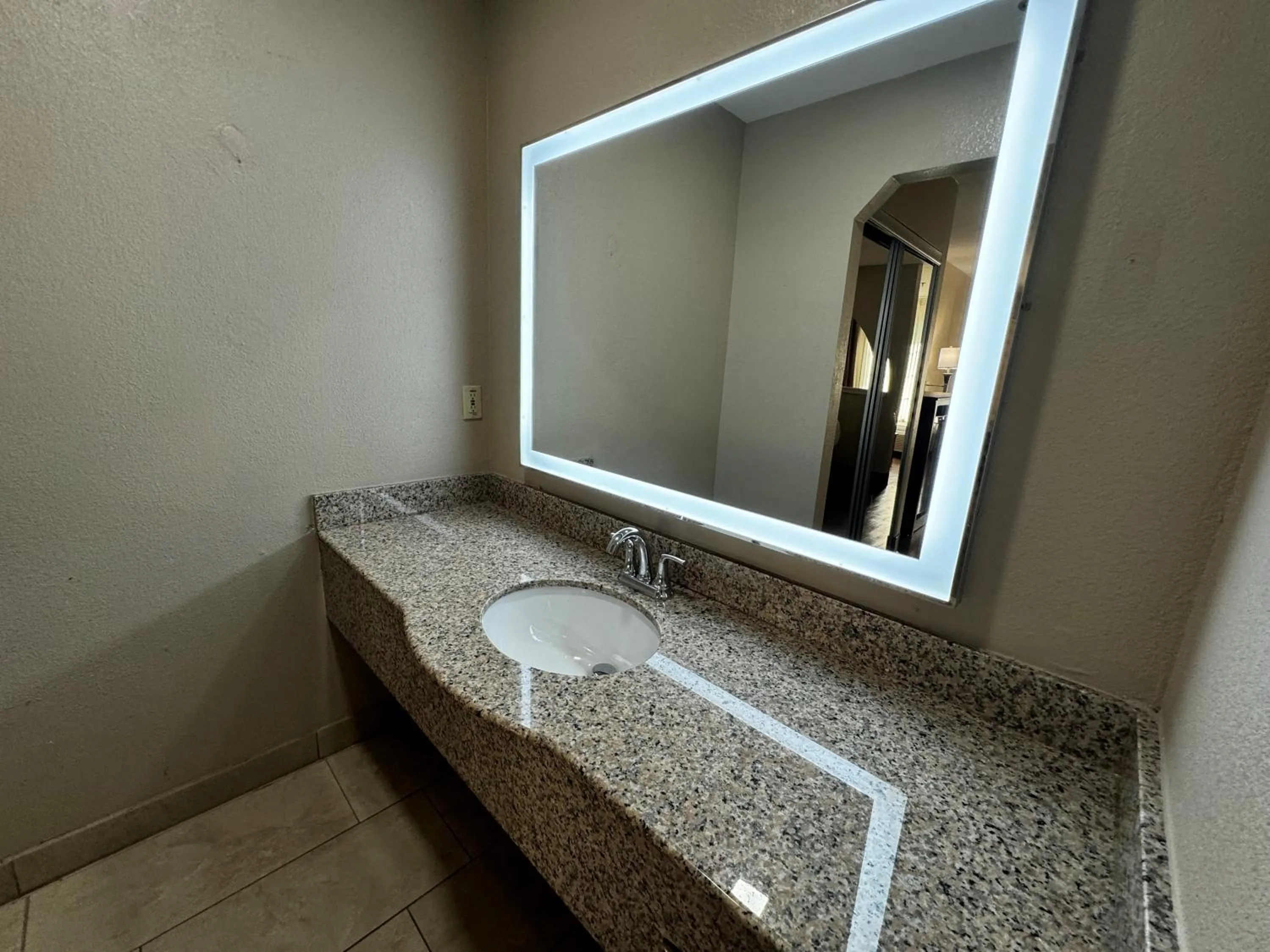 Bathroom in Super 8 by Wyndham Houston Webster NASA