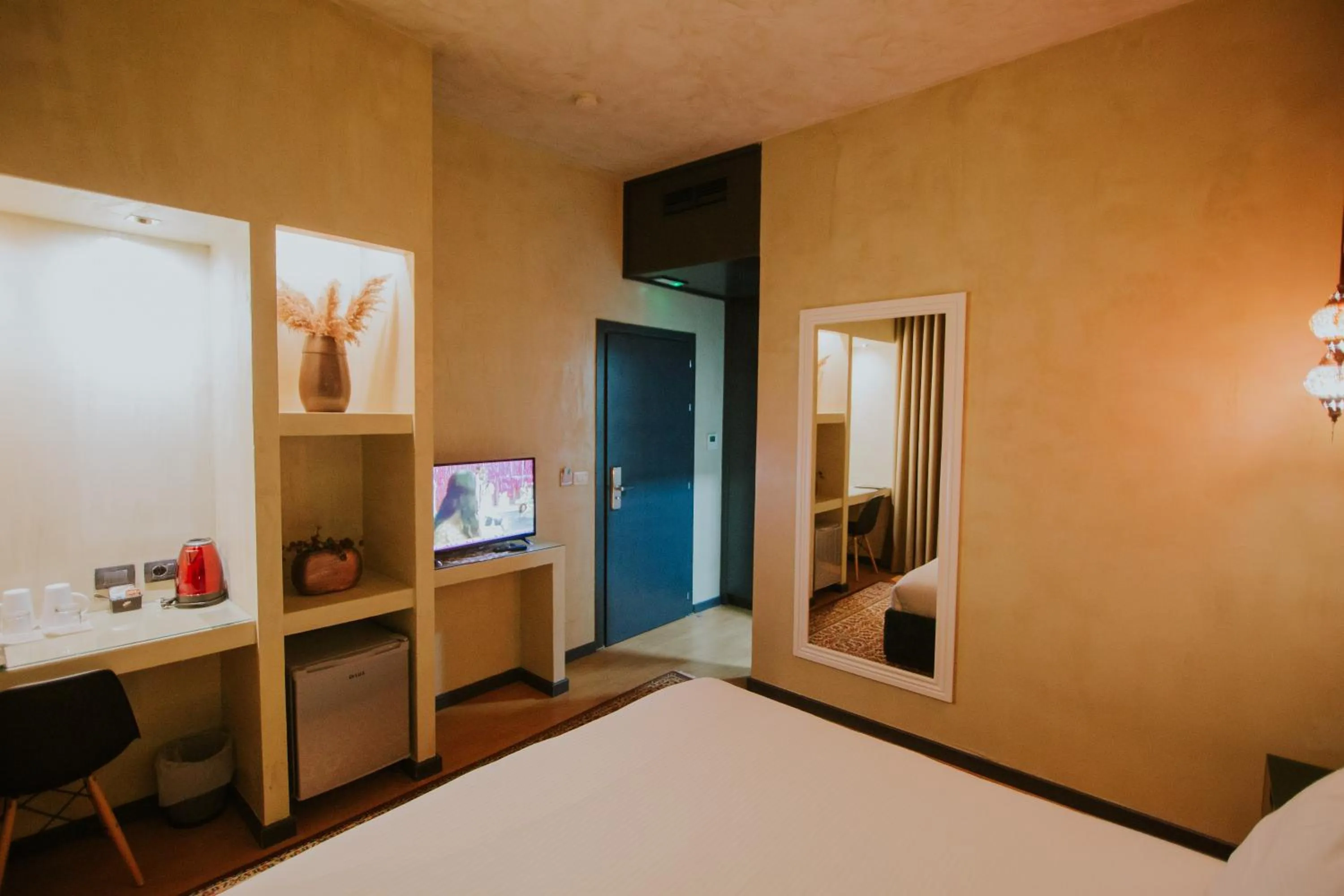 Bed in Dim's Hotel & Restaurant