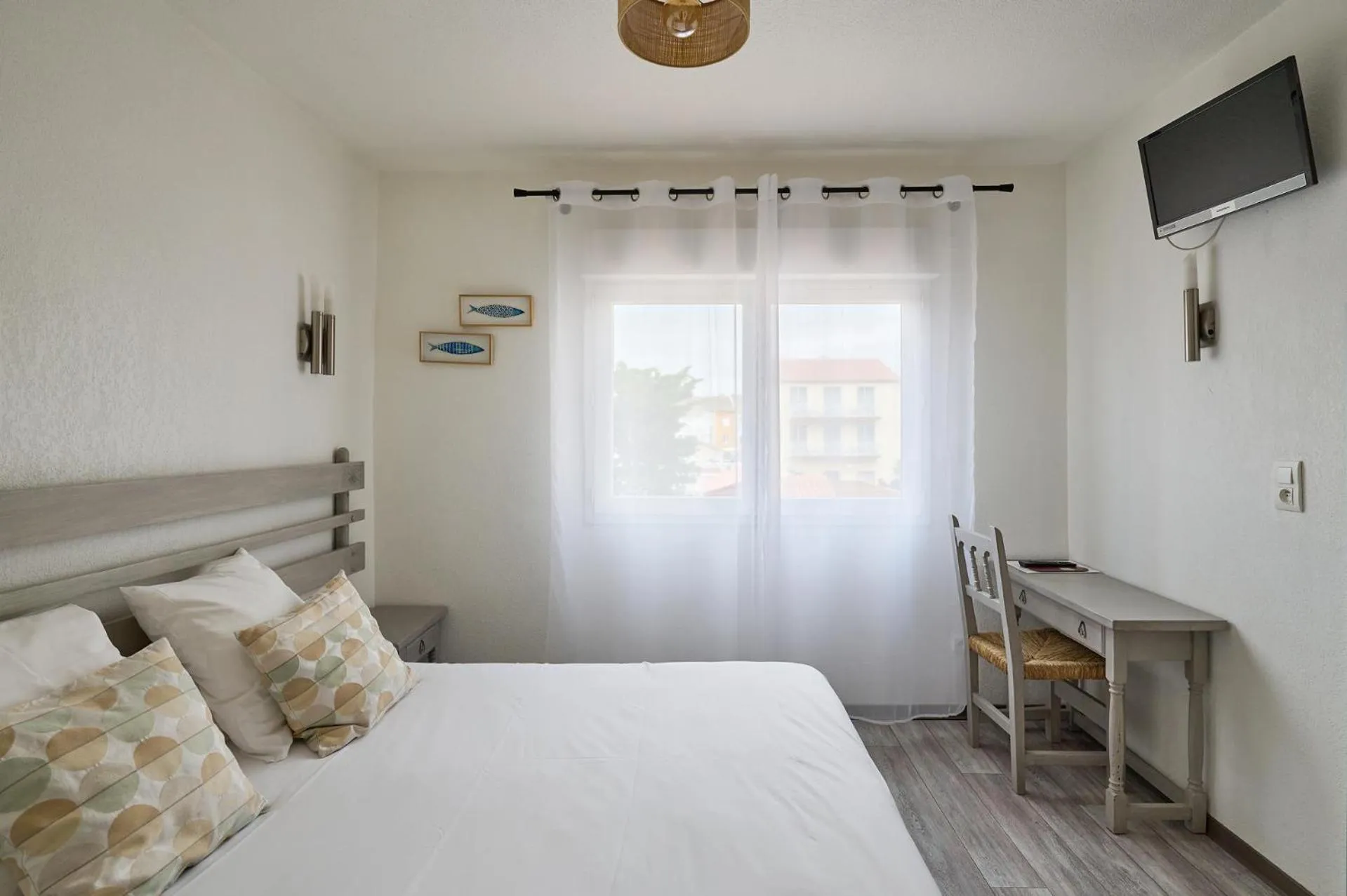 Bedroom in Hôtel Les Mimosas