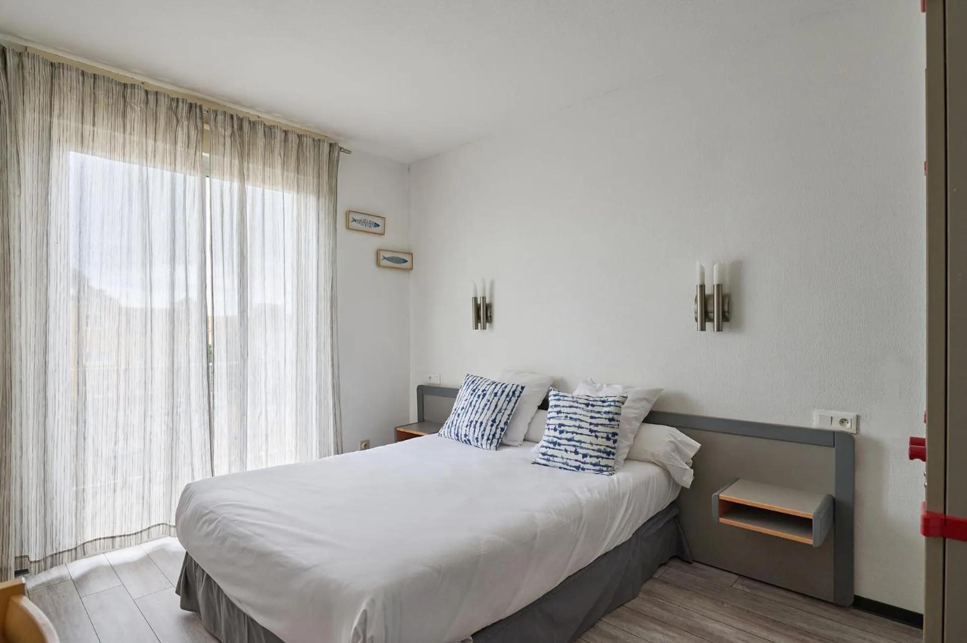 Bedroom in Hôtel Les Mimosas