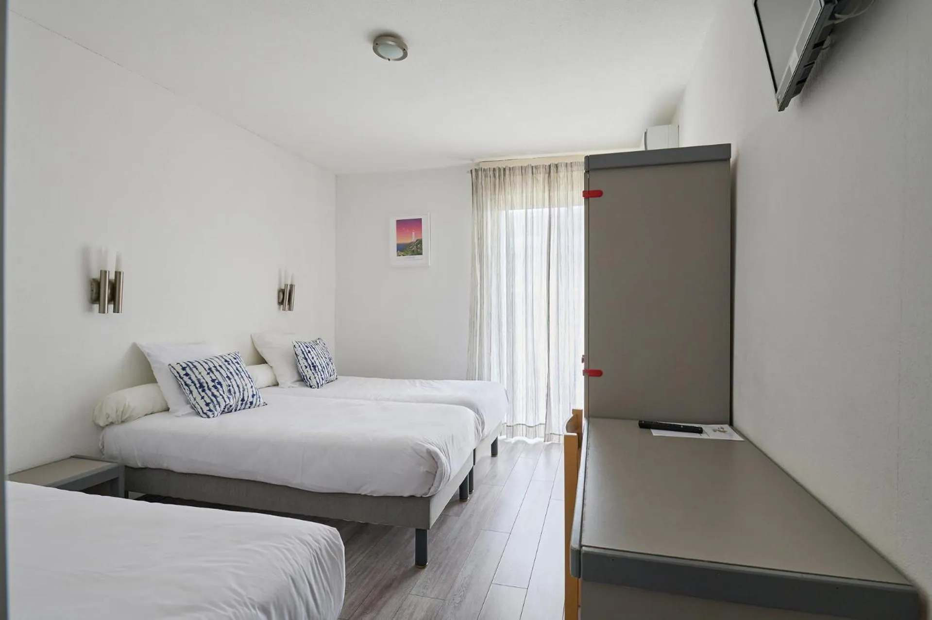 Bedroom in Hôtel Les Mimosas