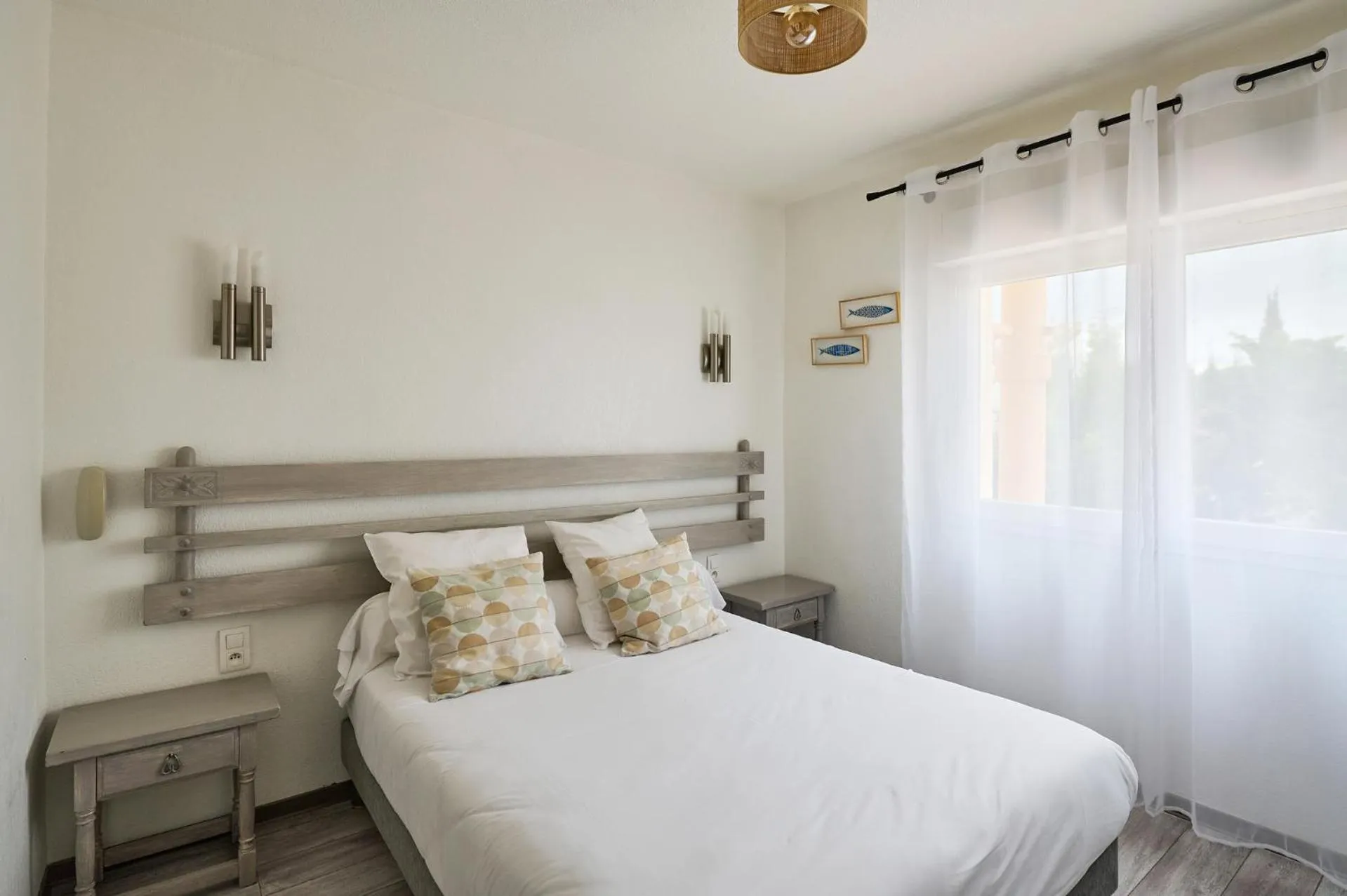 Bedroom in Hôtel Les Mimosas