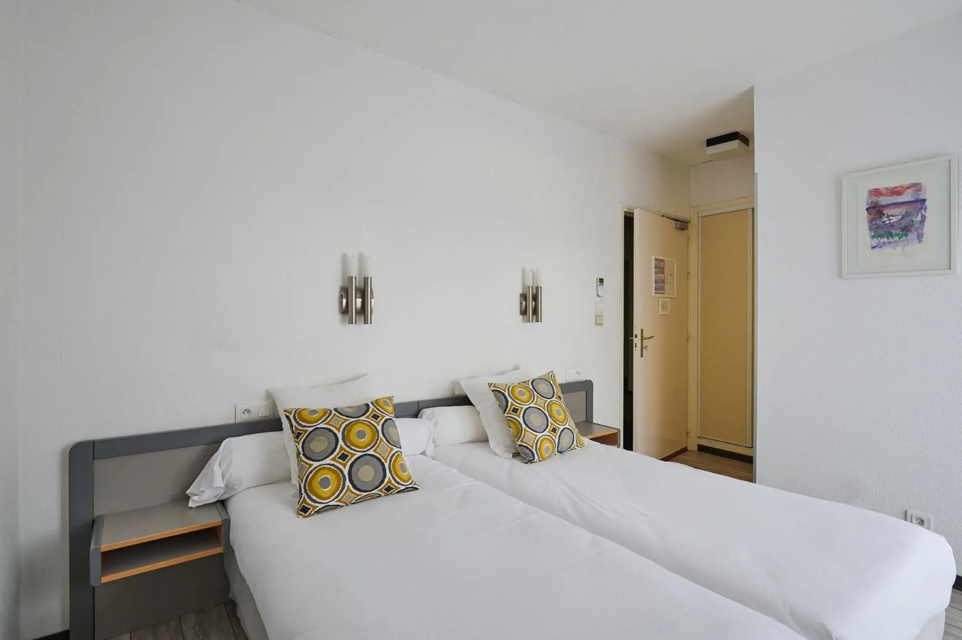 Bedroom in Hôtel Les Mimosas