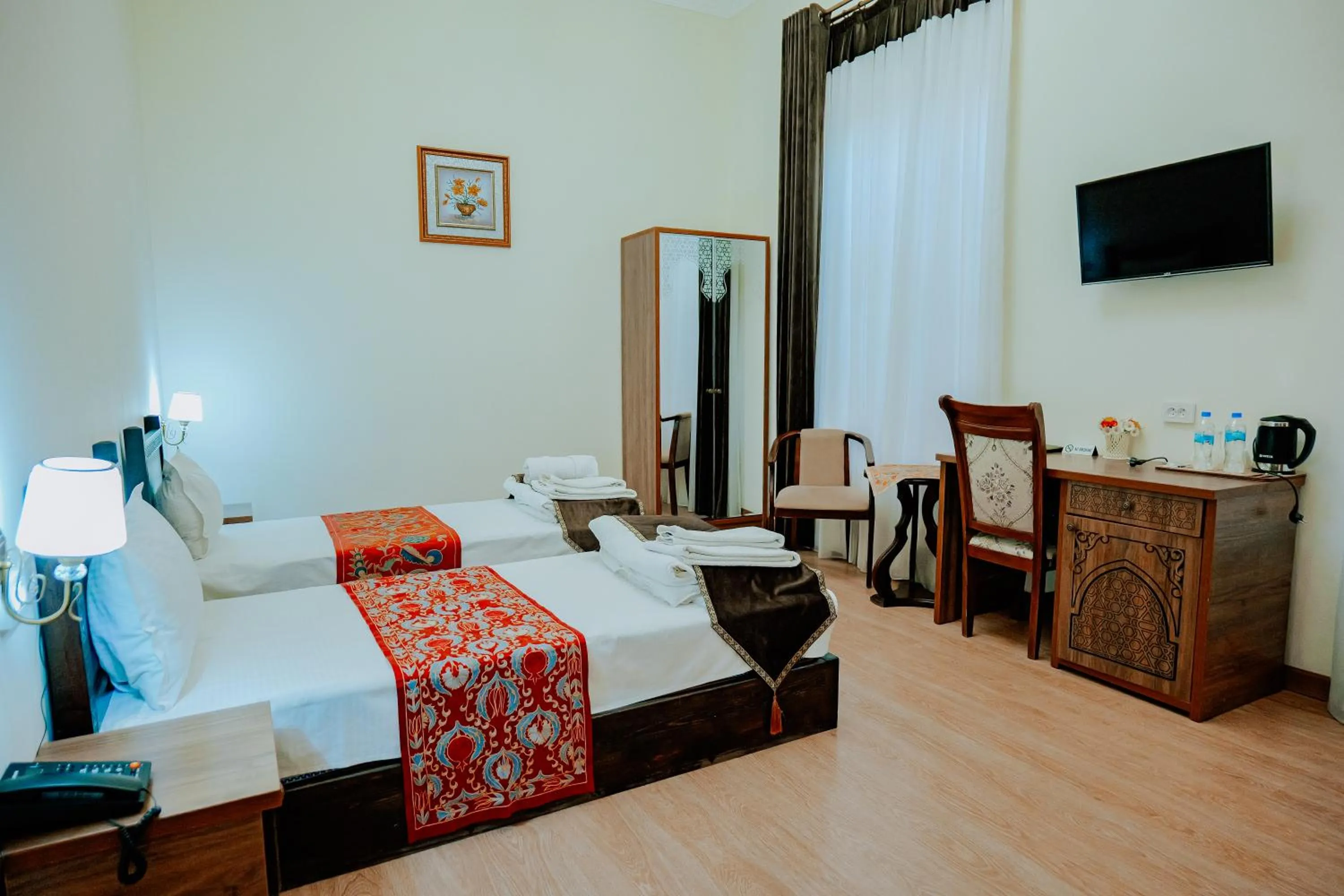 Communal lounge/ TV room, Bed in Imperial Palace Bukhara