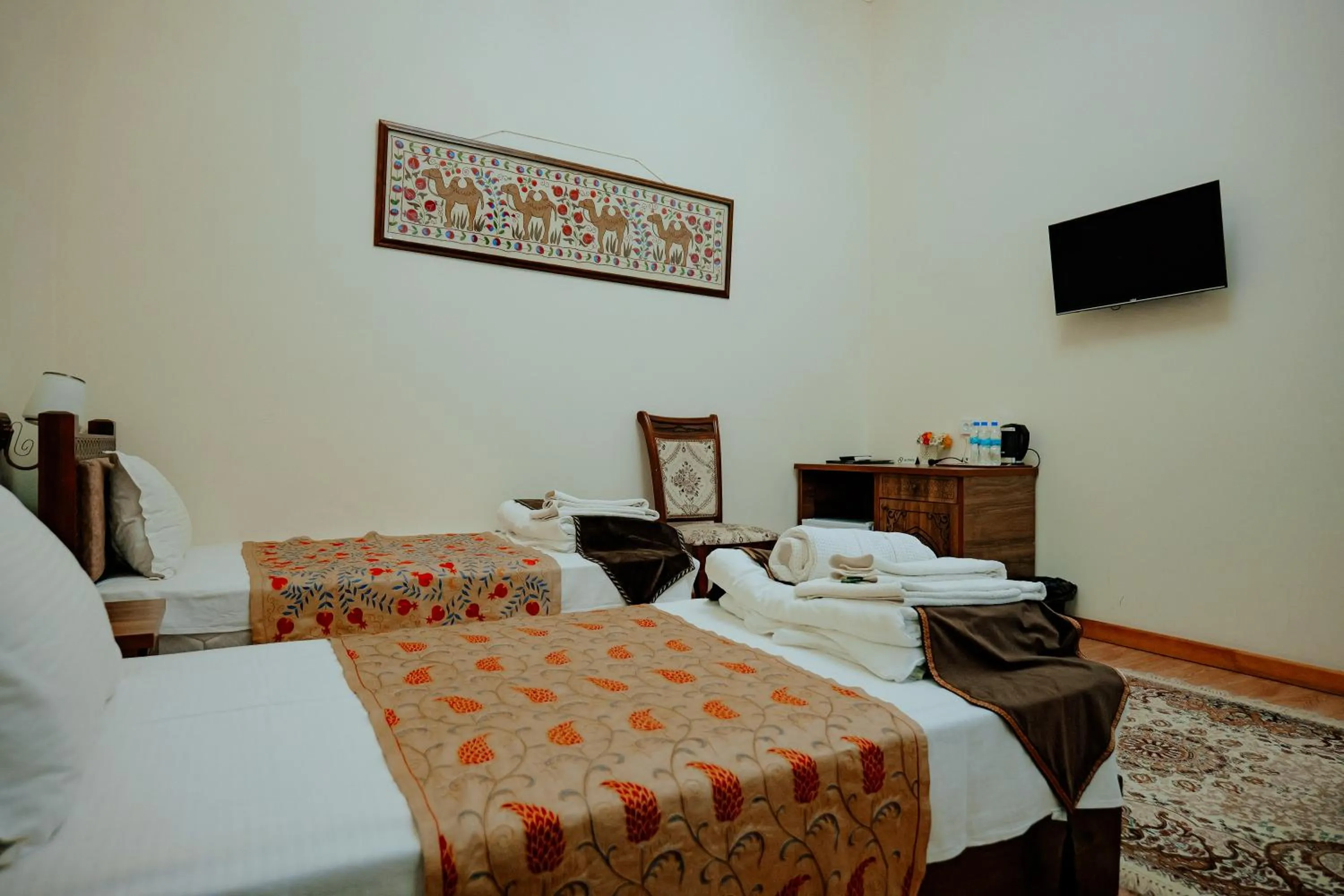 Communal lounge/ TV room, Bed in Imperial Palace Bukhara