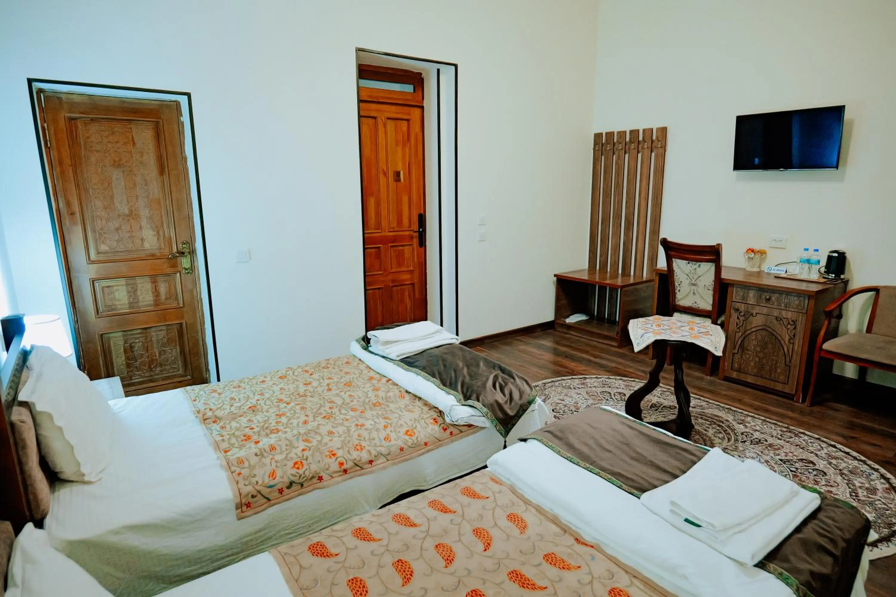 Communal lounge/ TV room, Bed in Imperial Palace Bukhara