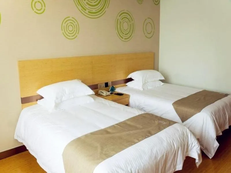 Bed in GreenTree Inn Nantong Qidong Binhai Industrial Park Nanhai RoadExpress Hotel