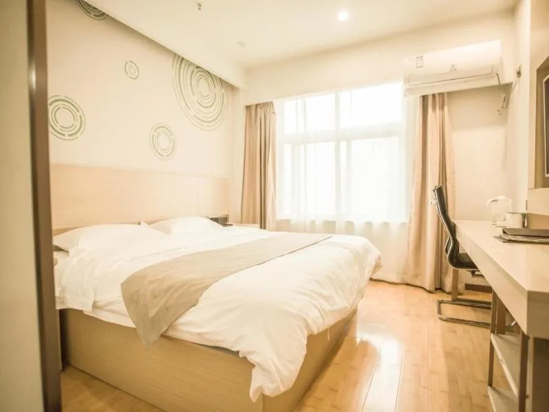 Bed in GreenTree Inn Heze Yucheng County Dongcheng International Business Hotel