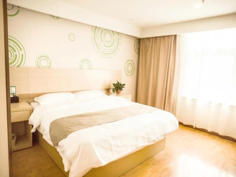 Bed in GreenTree Inn Heze Yucheng County Dongcheng International Business Hotel