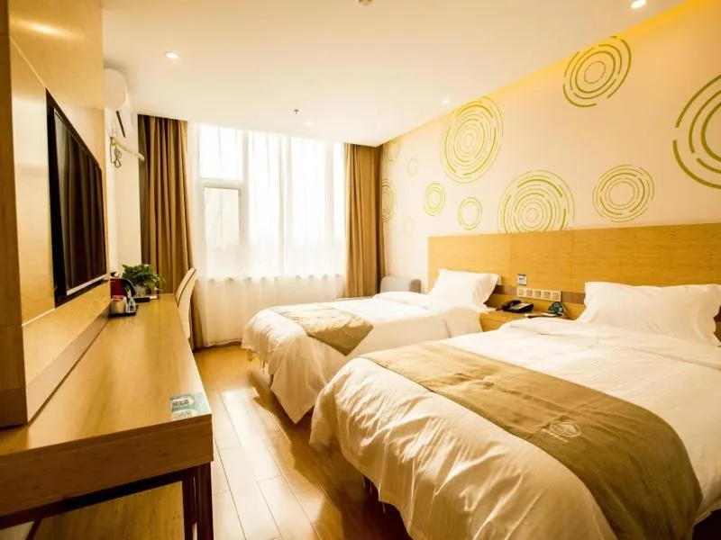 Bed in GreenTree Inn Handan Wei County Xianbiao Business Hotel