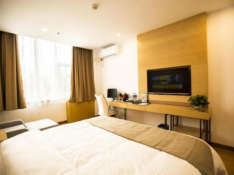 Bed in GreenTree Inn Handan Wei County Xianbiao Business Hotel