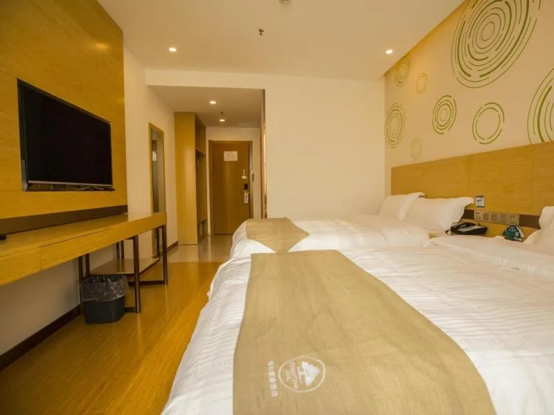 Bed in GreenTree Inn Handan Wei County Xianbiao Business Hotel