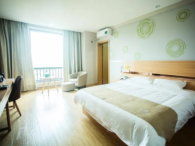 Bed in GreenTree Inn Zhoushan Baiquan Colorful Plaza Express Hotel