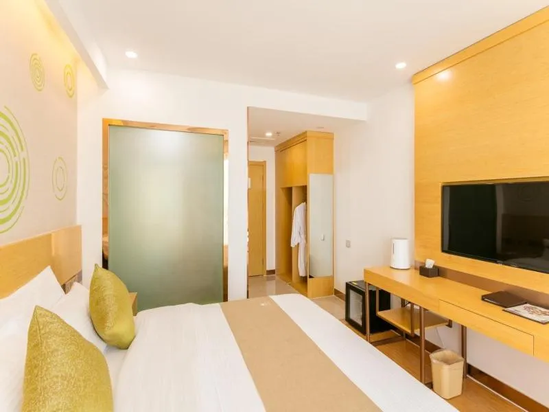 Bed in GreenTree Inn Jining Qufu High Speed Railway Station Express Hotel