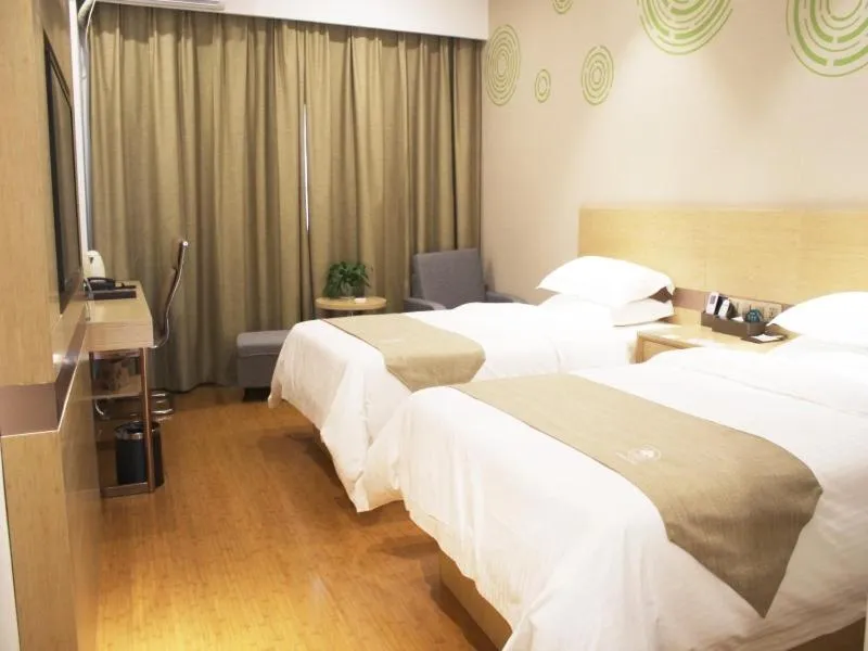 Bed in GreenTree Inn Zhengzhou Fangte Green Expo Park Shangdu Road Express Hotel