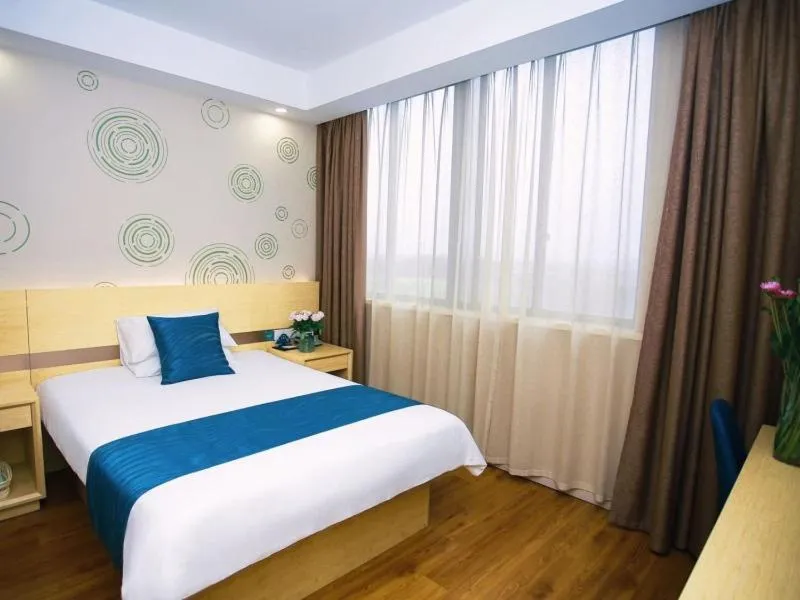 Bed in GreenTree Inn NantongHaian Development Zone Chengdong Town Express Hotel