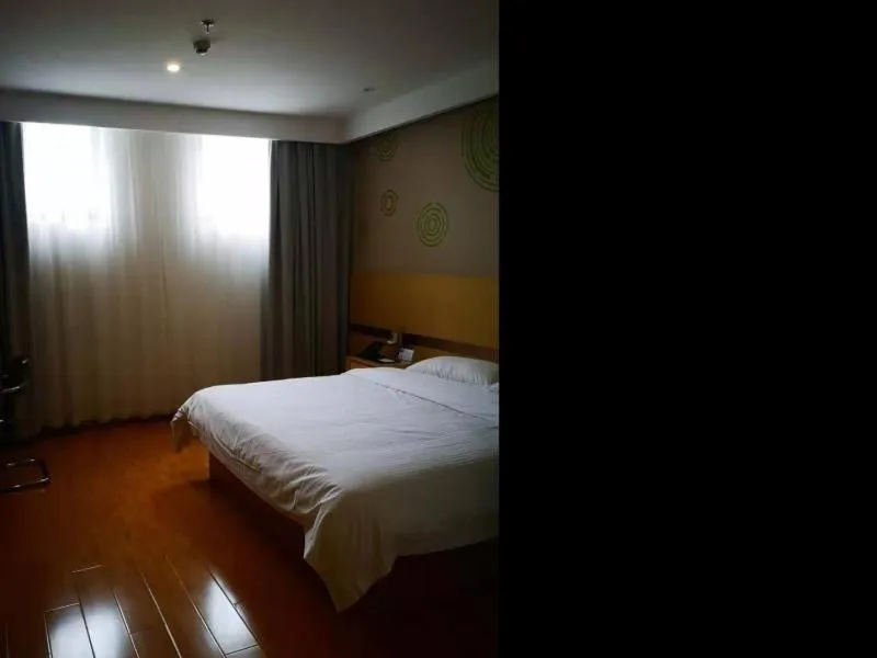 Bed in GELI Hotel Zaozhuang High-speed Rialway Station
