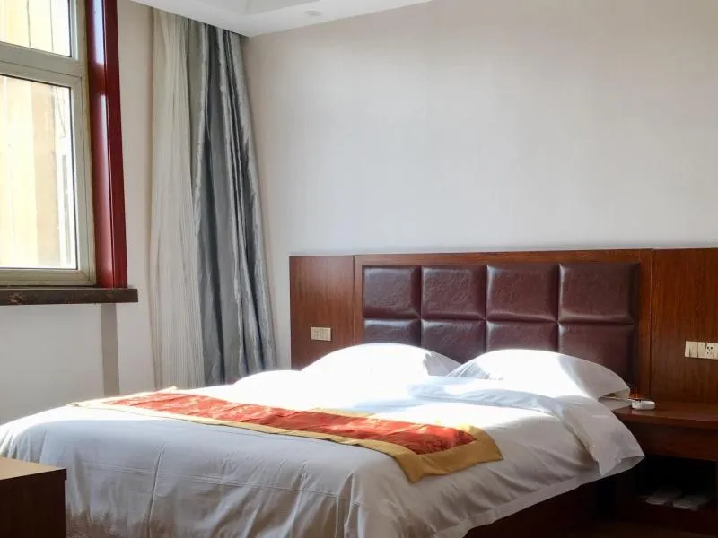 Bed in GreenTree Alliance Tianshui Railway Station Hotel