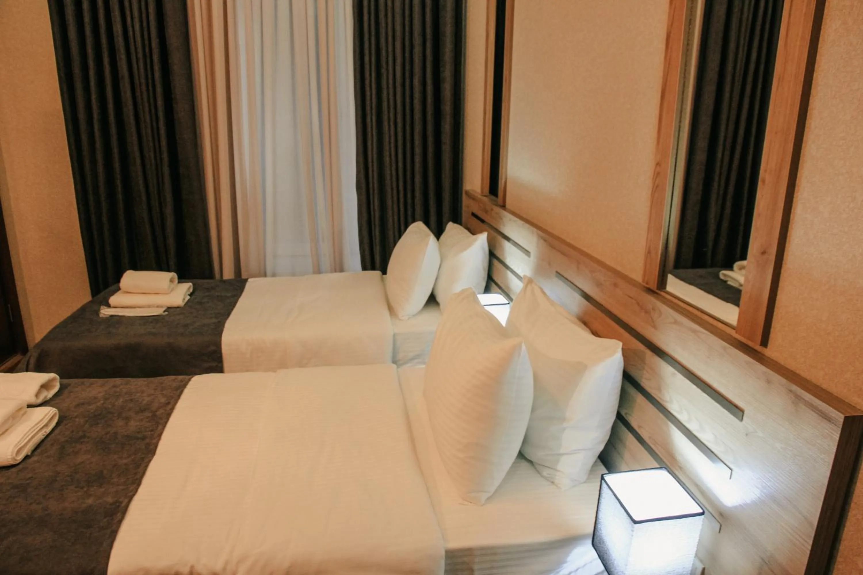 Bed in City Heart Hotel