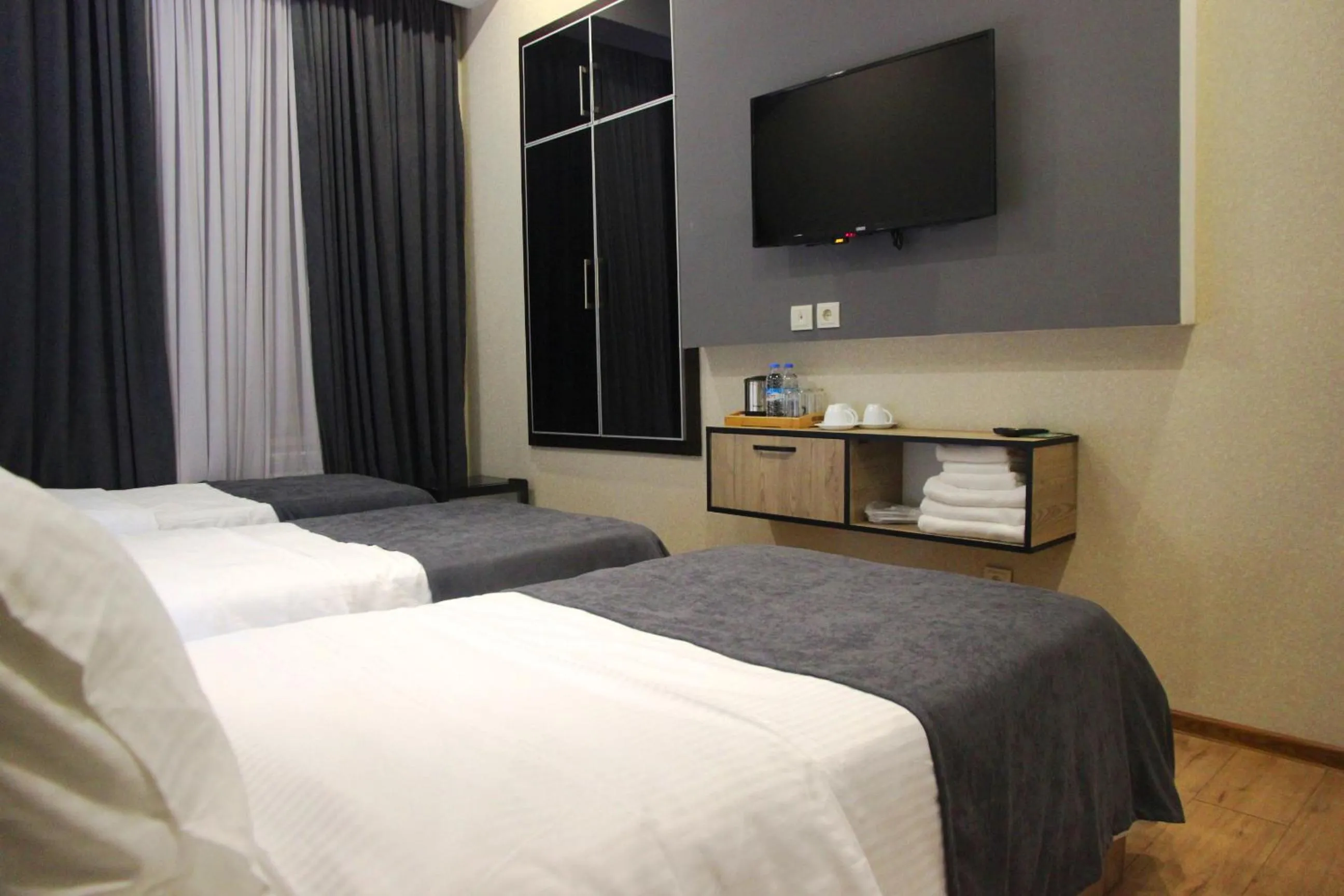 Bed in City Heart Hotel