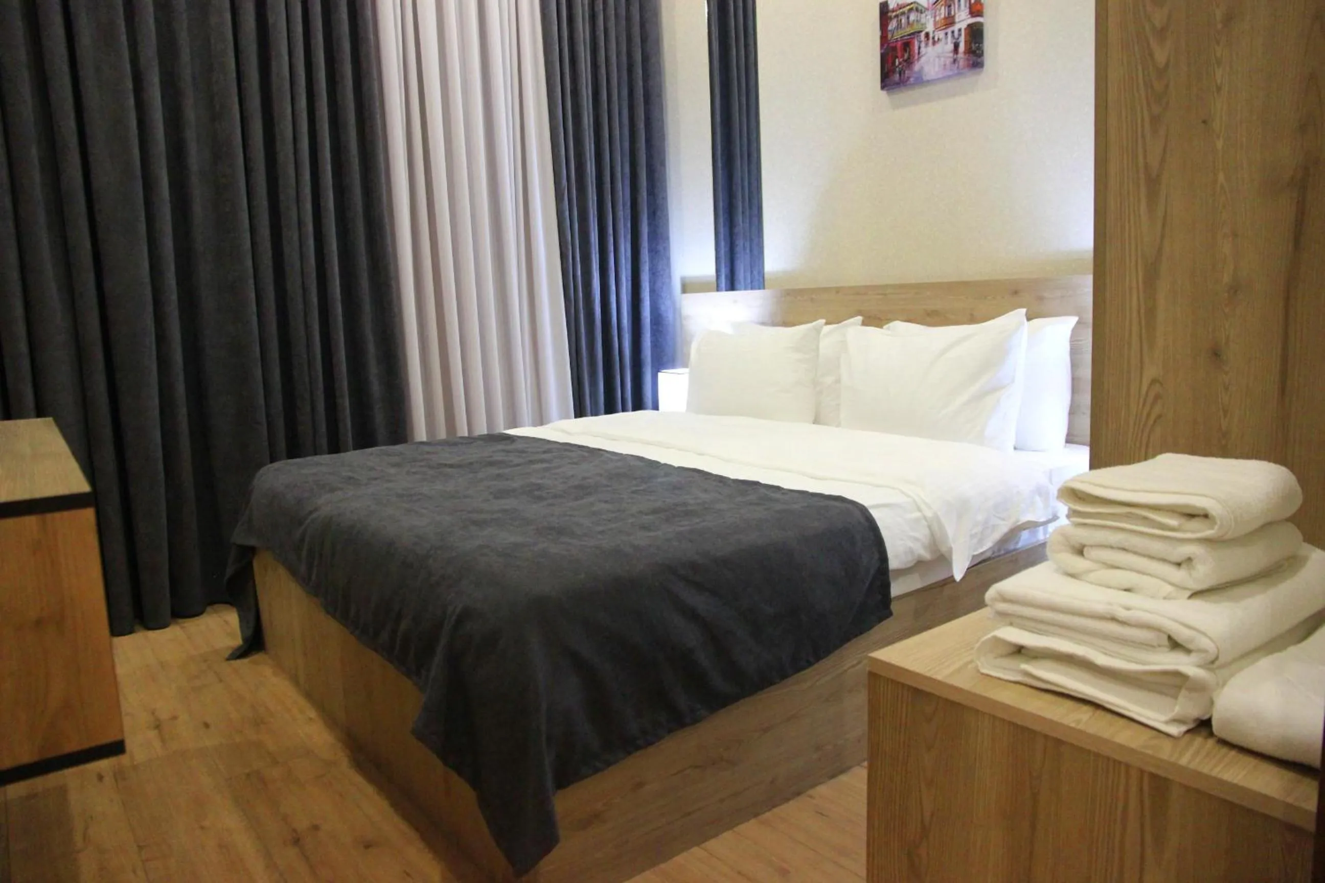 Bed in City Heart Hotel