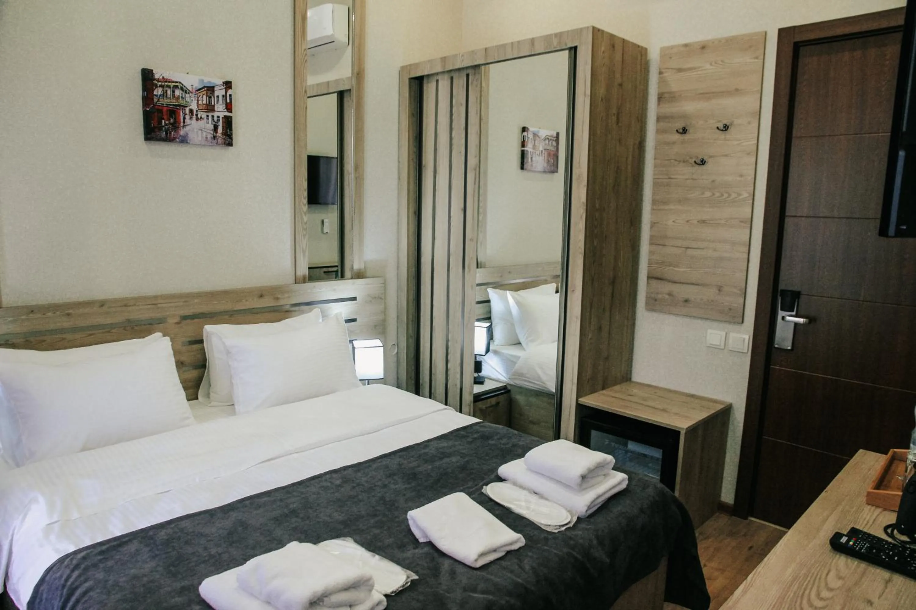 Bed in City Heart Hotel