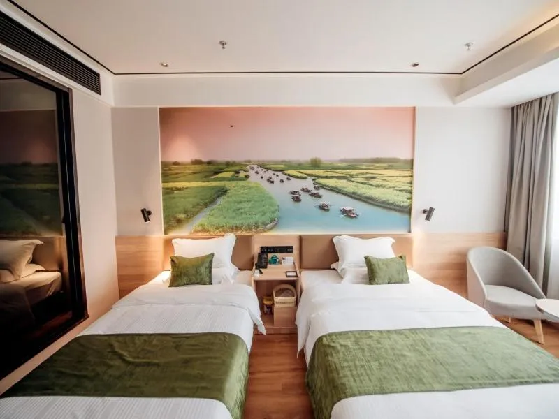Bed in GreenTree Inn Taizhou Xinghua City Zhouzhuang Town Business Hotel