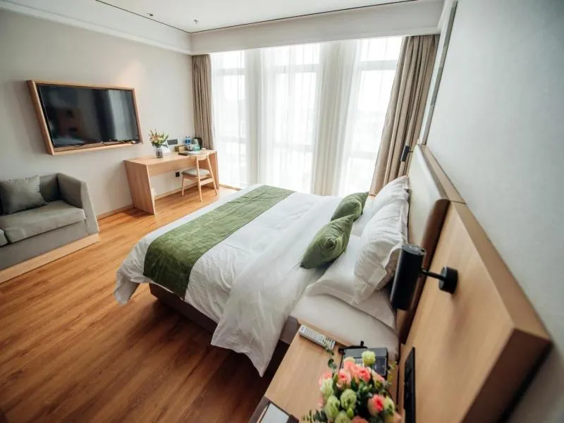 Bed in GreenTree Inn Taizhou Xinghua City Zhouzhuang Town Business Hotel