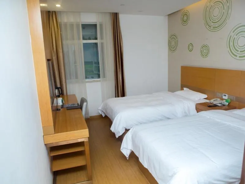 Bed in GreenTree Inn Yangzhou Railway Station Jinzhankou Business Hotel