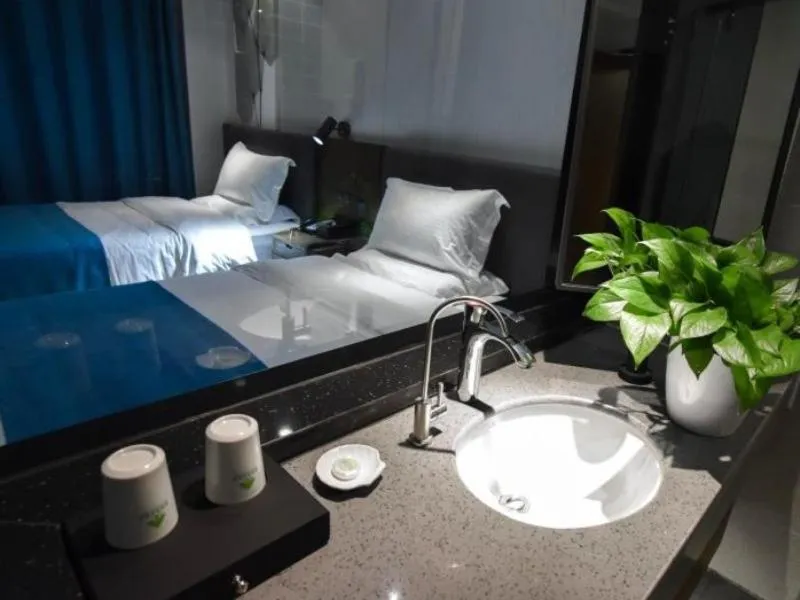 Bed in GreenTree Rizhao Lanshan Coach Station Hotel