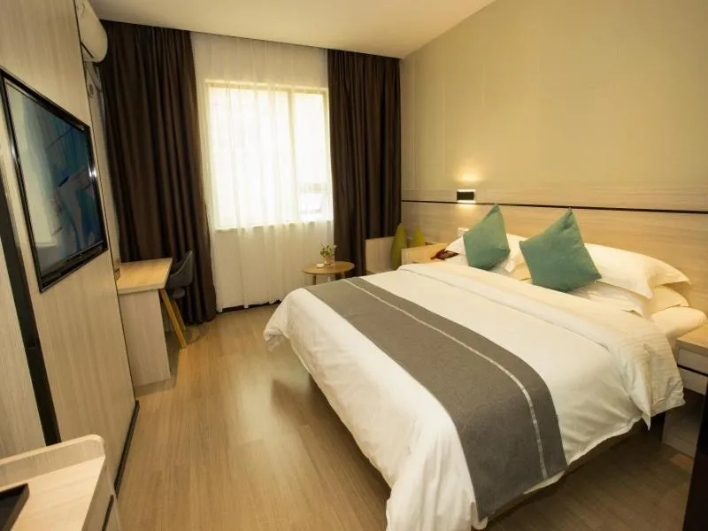 Bed in GreenTree Inn Yulin Exhibition Center Darunfa Hotel