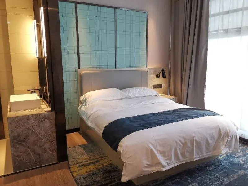 Bed in GreenTree Eastern Lianyungang Jiaruibao Plaza Hotel