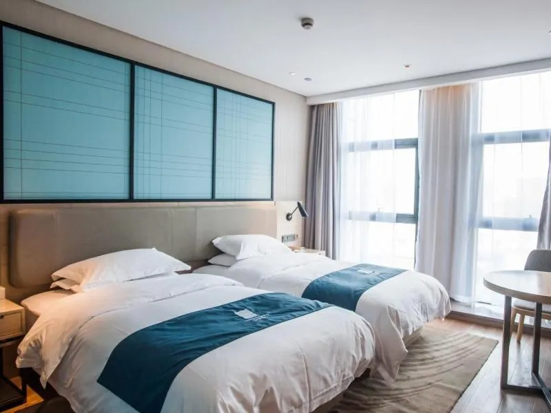 Bed in GreenTree EasternLianyungang Wanda Plaza Hotel