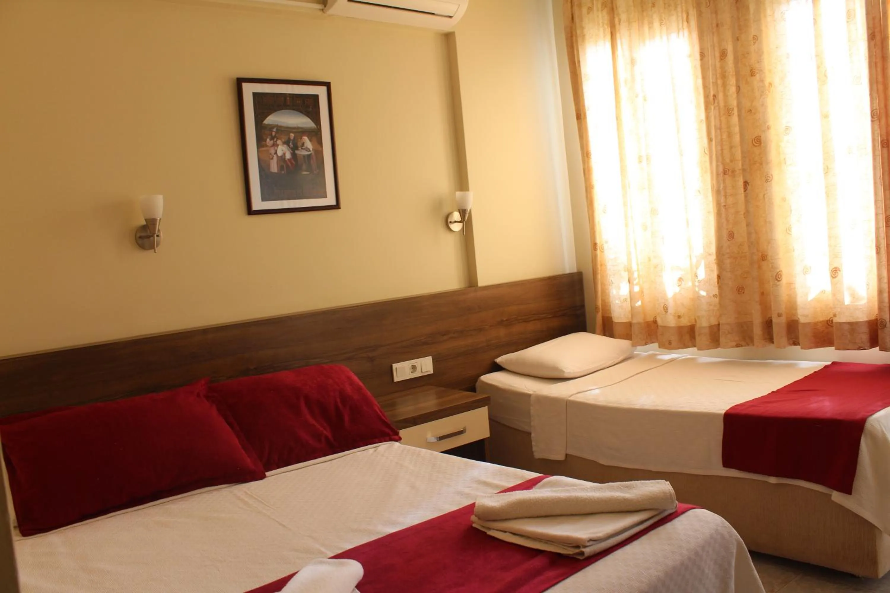 Bed in Dove Apart Hotel