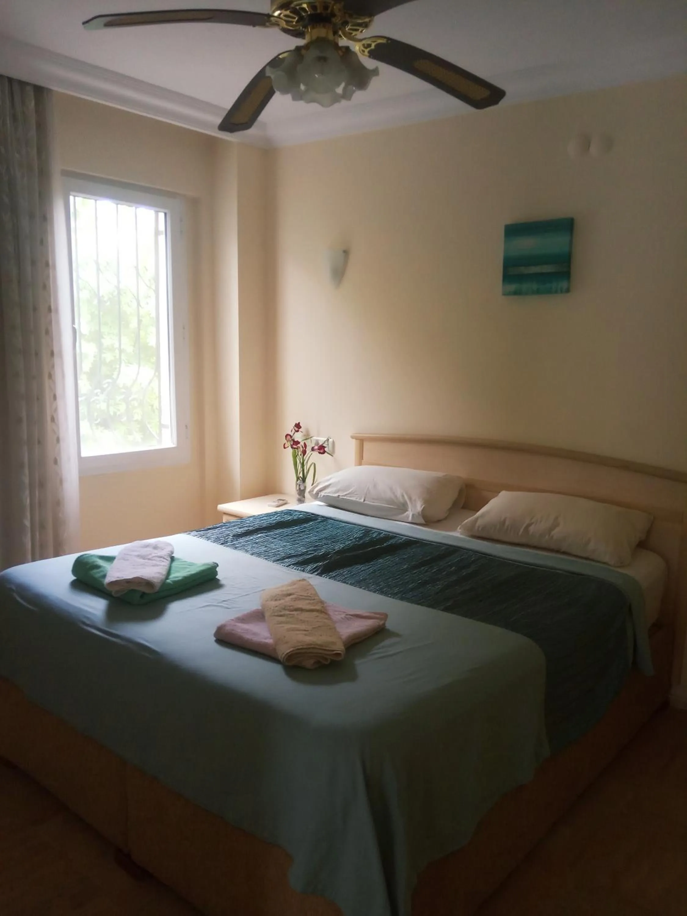 Bed in Dove Apart Hotel