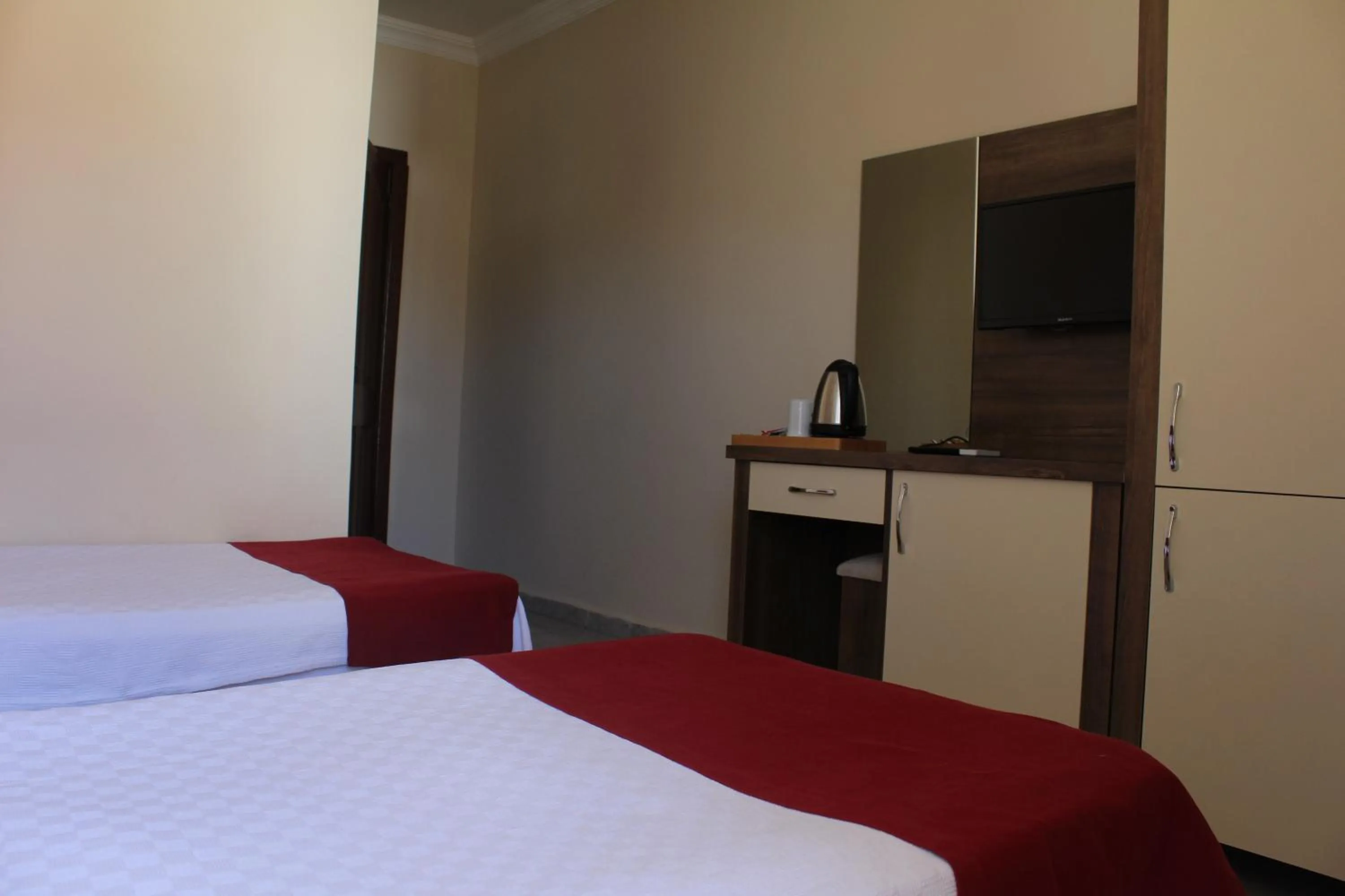 Bed in Dove Apart Hotel