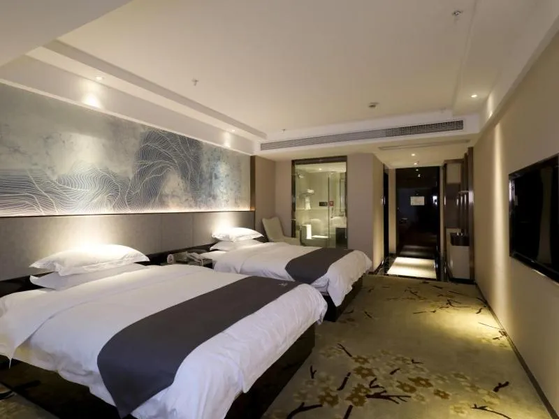 Bed in GreenTree Eastern Jingde Town Railway Station Hotel