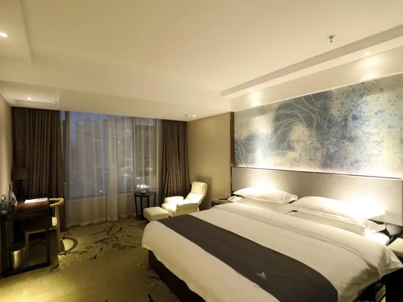 Bed in GreenTree Eastern Jingde Town Railway Station Hotel